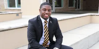 Cornelius Clyde computer science degree student Tapia College of Business building steps